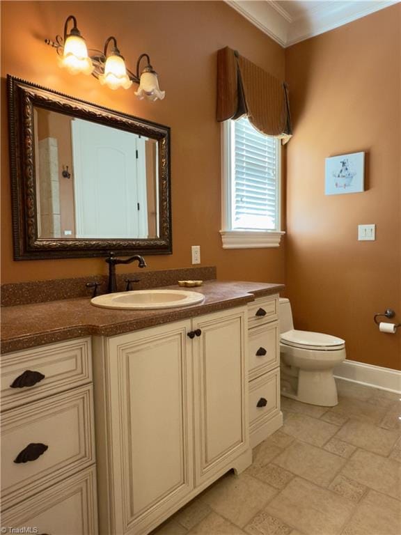 2863 Spencer Rd, Archdale, NC 27263 - bathroom with crown molding, vanity, toilet, baseboards, and stone finish flooring