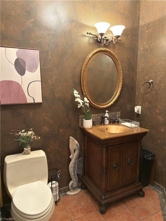 2863 Spencer Rd, Archdale, NC 27263 - bathroom featuring tile patterned flooring, vanity, toilet, and baseboards