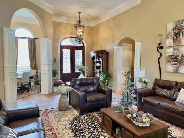 2863 Spencer Rd, Archdale, NC 27263 - living area featuring arched walkways, a high ceiling, a chandelier, and ornamental molding