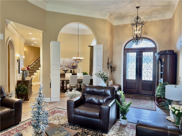 2863 Spencer Rd, Archdale, NC 27263 - entryway featuring a chandelier, arched walkways, french doors, stairway, and ornamental molding