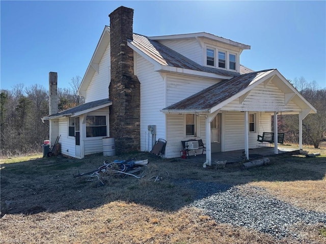 view of front of property featuring a chimney