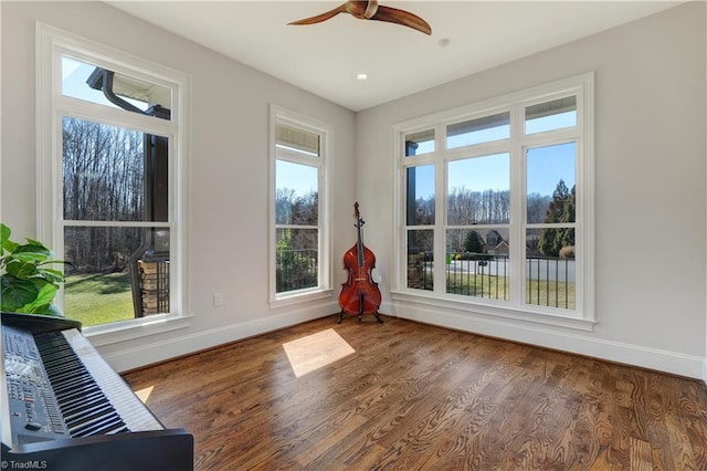 interior space featuring ceiling fan, recessed lighting, wood finished floors, and baseboards