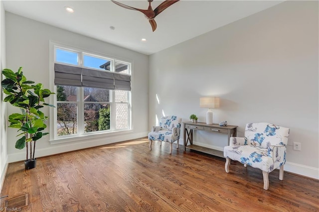 sitting room featuring recessed lighting, wood finished floors, visible vents, and baseboards