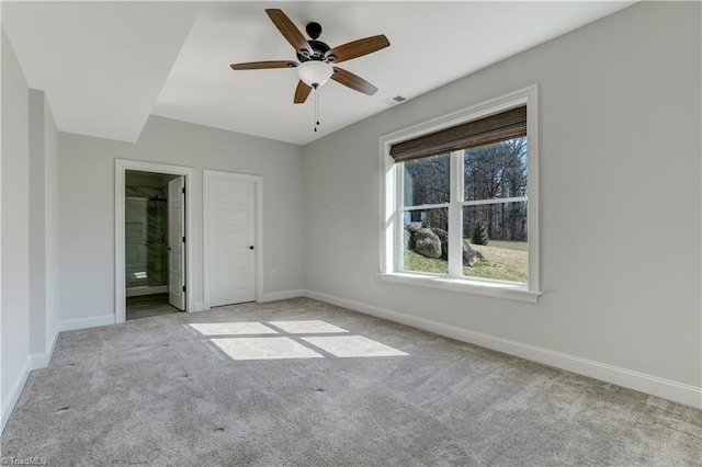 unfurnished bedroom featuring visible vents, baseboards, and carpet flooring