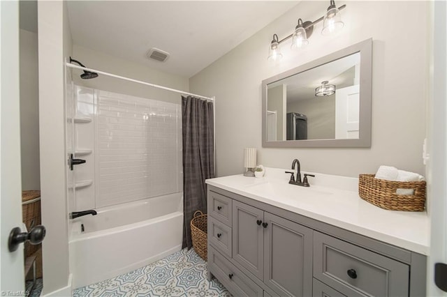 full bath with tile patterned flooring, visible vents, vanity, and shower / bath combo with shower curtain