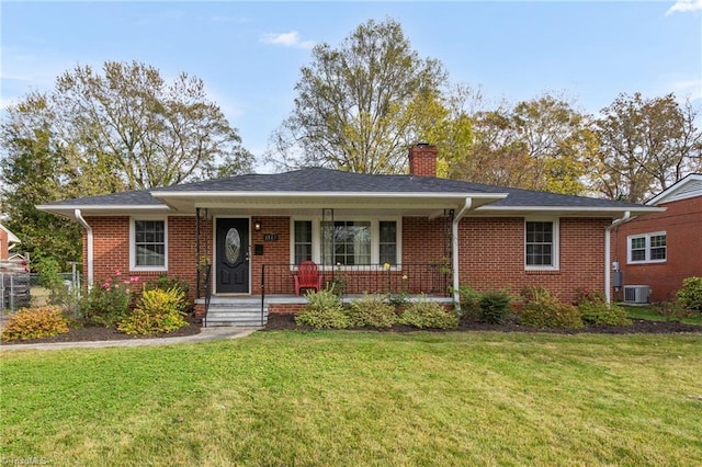 view of front facade featuring central AC, a front lawn, and covered porch