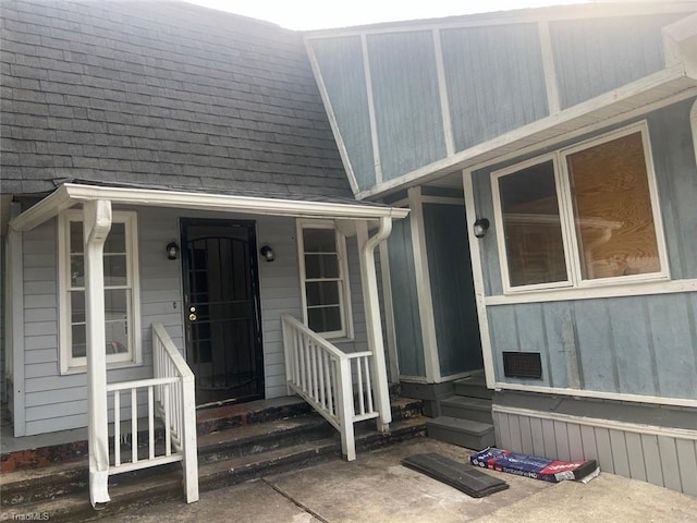 property entrance featuring covered porch