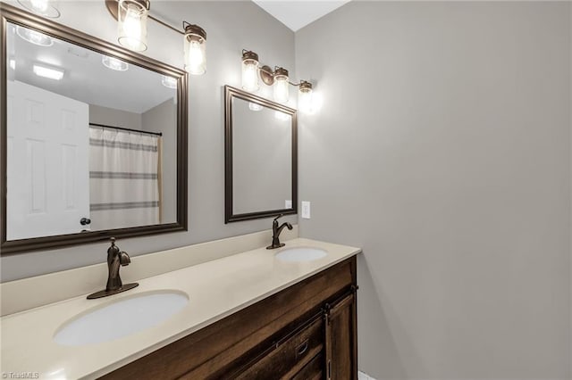 bathroom with double vanity and a sink