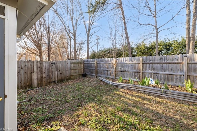 view of yard with a fenced backyard