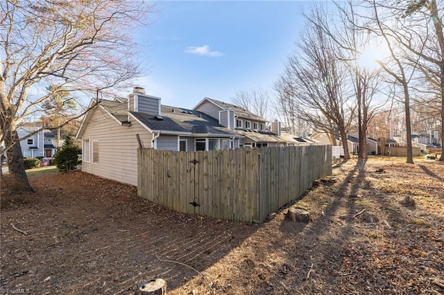 exterior space with a residential view and fence