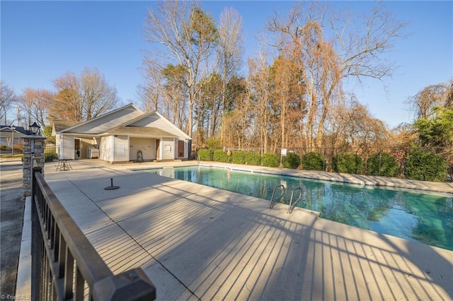 view of swimming pool with a fenced in pool, a patio, and fence