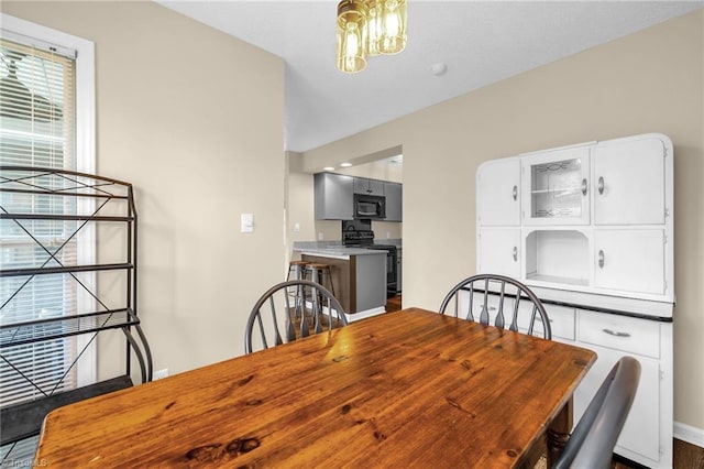 dining space featuring baseboards