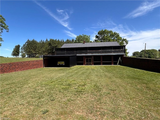 rear view of property with a yard