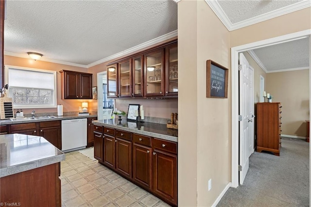 kitchen with a sink, a textured ceiling, crown molding, glass insert cabinets, and dishwasher