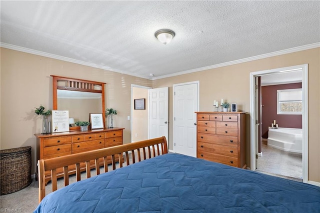 bedroom featuring ensuite bathroom, a textured ceiling, crown molding, and carpet