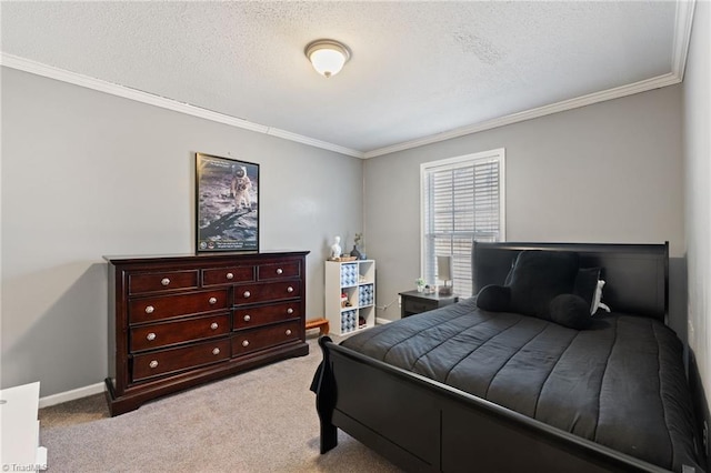 bedroom with carpet flooring, a textured ceiling, baseboards, and ornamental molding