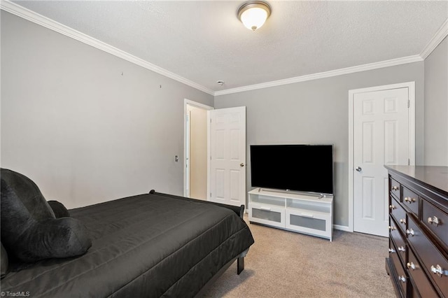 carpeted bedroom with a textured ceiling, baseboards, and ornamental molding