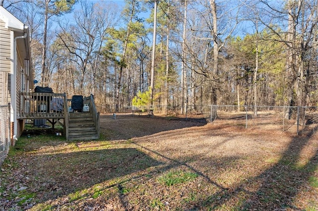 view of yard with a wooden deck and fence private yard