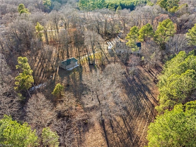 bird's eye view featuring a wooded view