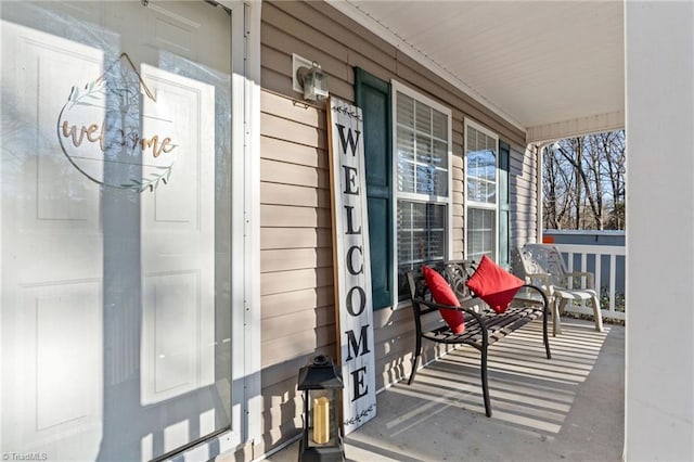 entrance to property featuring a porch