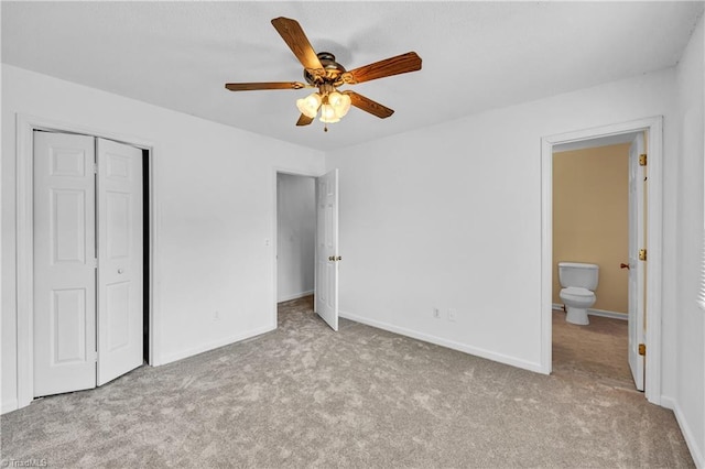 unfurnished bedroom featuring carpet floors, a closet, ceiling fan, and baseboards