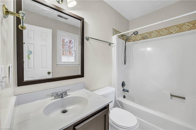 bathroom with visible vents, vanity, toilet, and bathing tub / shower combination