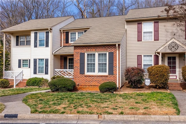 view of front of home featuring brick siding