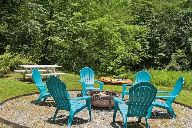 view of yard with an outdoor fire pit