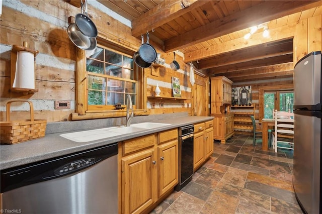 kitchen featuring wood walls, appliances with stainless steel finishes, wooden ceiling, and beam ceiling