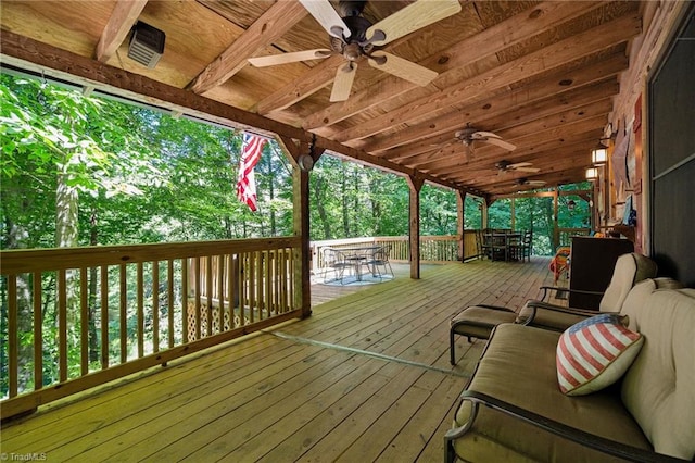 wooden terrace featuring ceiling fan