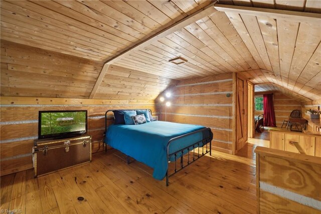 bedroom featuring wooden ceiling, lofted ceiling, and hardwood / wood-style floors