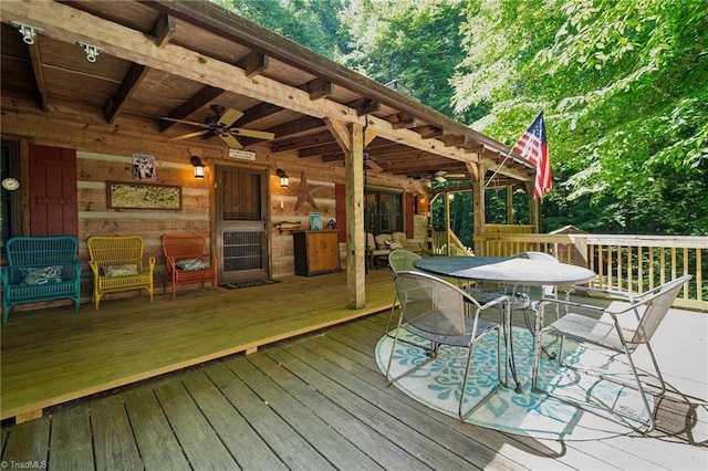 wooden terrace featuring ceiling fan