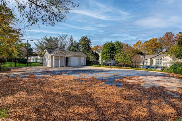 exterior space with an outbuilding and a garage