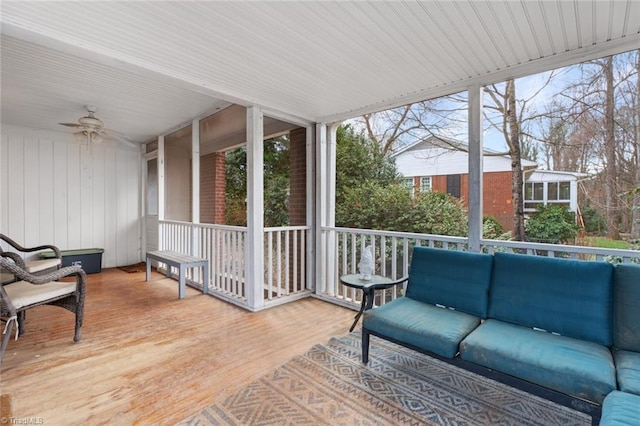 sunroom with plenty of natural light and ceiling fan