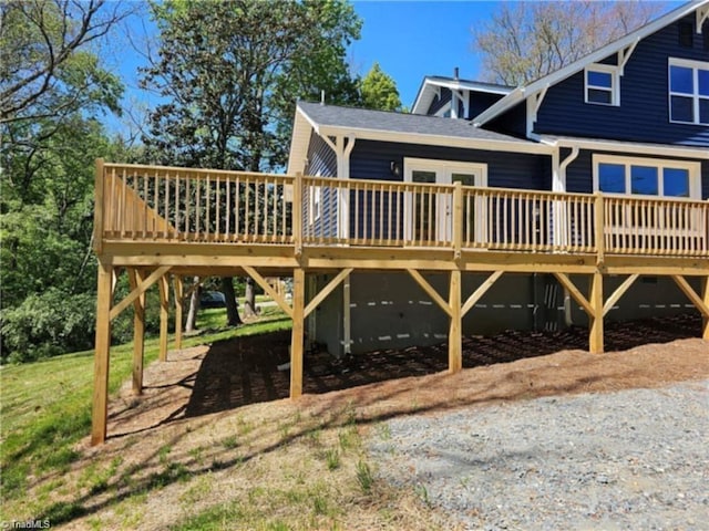 back of house featuring a deck