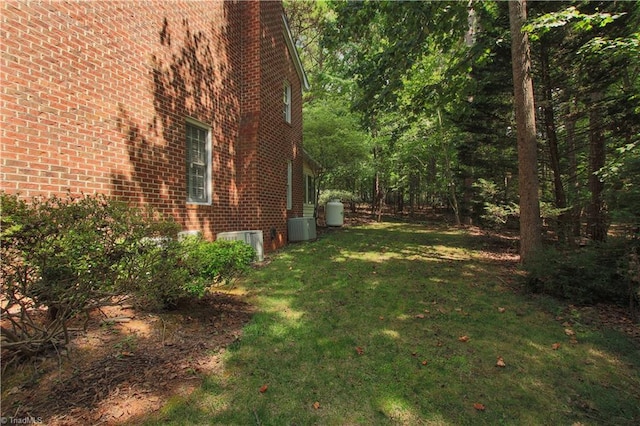 view of yard featuring central air condition unit