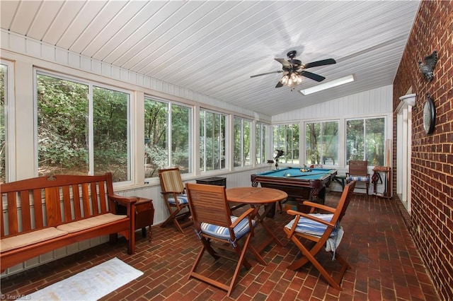 sunroom / solarium with vaulted ceiling, a ceiling fan, and pool table