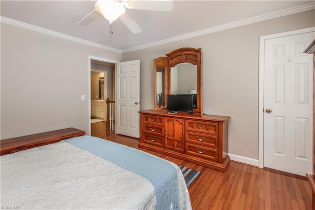 bedroom featuring hardwood / wood-style floors, ceiling fan, and crown molding