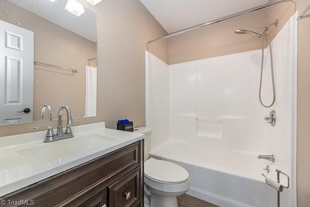 full bathroom with bathtub / shower combination, vanity, and toilet