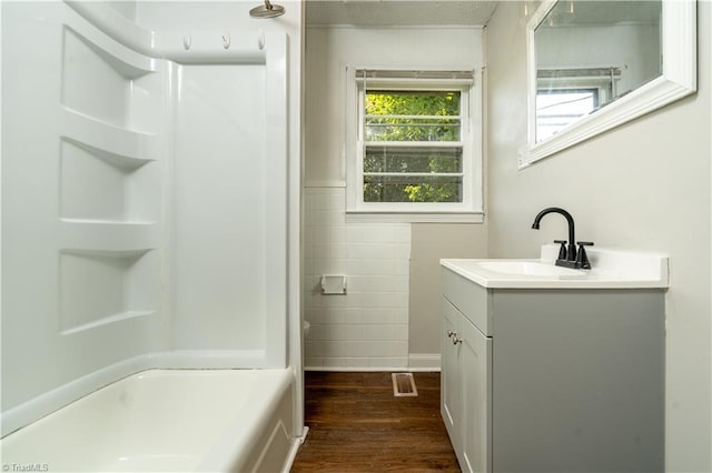 4362 Parsonsville Rd, Purlear, NC 28665 - full bathroom with vanity, wood finished floors, and washtub / shower combination