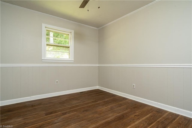 4362 Parsonsville Rd, Purlear, NC 28665 - spare room featuring dark wood-type flooring, ceiling fan, baseboards, ornamental molding, and wainscoting