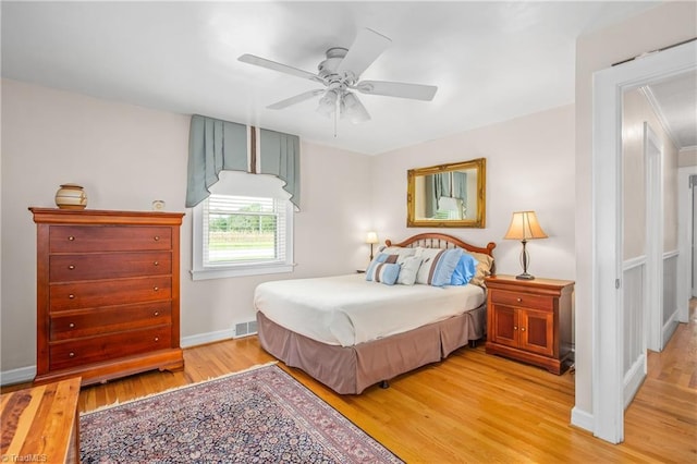 bedroom featuring light hardwood / wood-style floors and ceiling fan