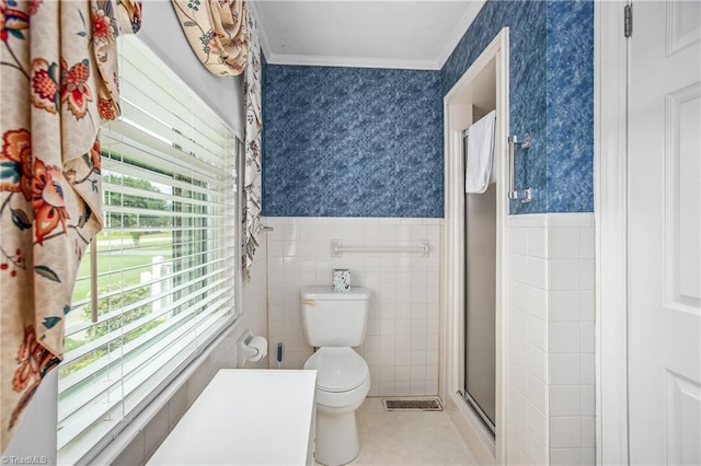 bathroom with toilet, walk in shower, and ornamental molding