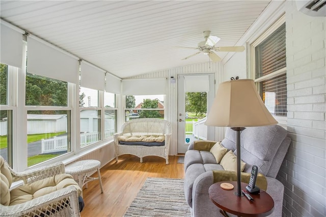 sunroom with ceiling fan and lofted ceiling