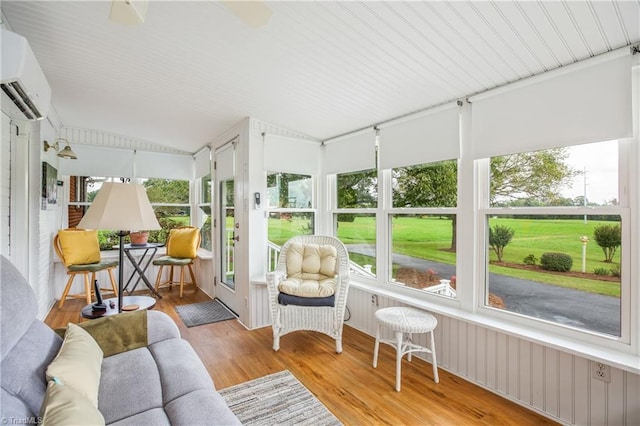 sunroom / solarium with a wall mounted AC