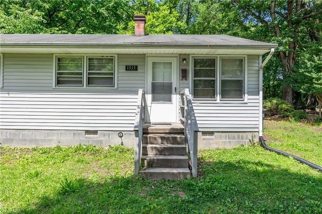 1515 Tucker St, Greensboro, NC 27405 - bungalow with a front lawn, crawl space, and a chimney