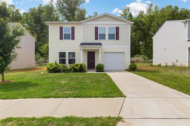 traditional-style home with concrete driveway, an attached garage, and a front lawn