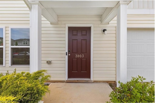 property entrance featuring a garage