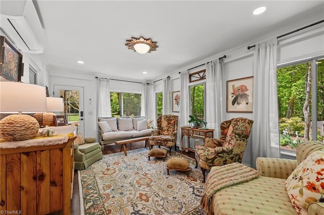 interior space featuring wood finished floors, a healthy amount of sunlight, recessed lighting, and a wall mounted AC