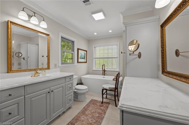bathroom with recessed lighting, vanity, crown molding, visible vents, and a freestanding bath